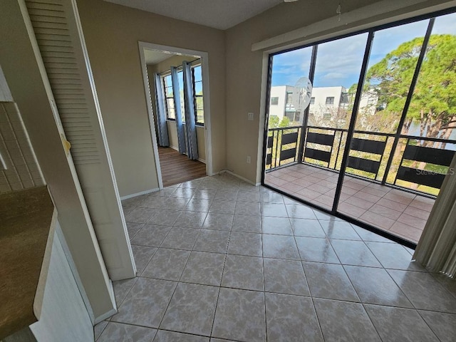 doorway to outside featuring tile patterned floors