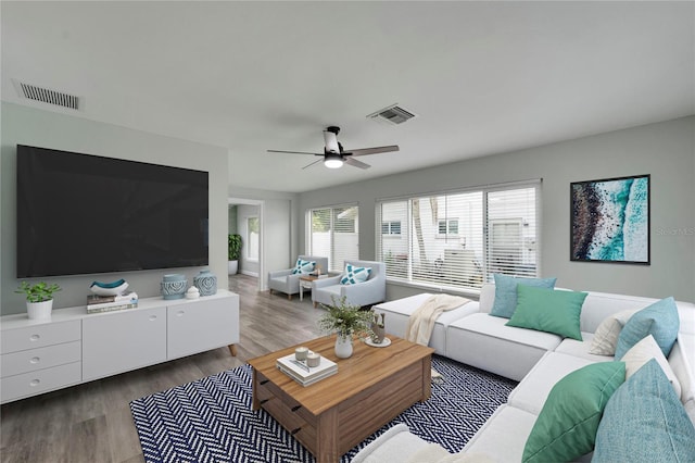 living room with hardwood / wood-style floors and ceiling fan