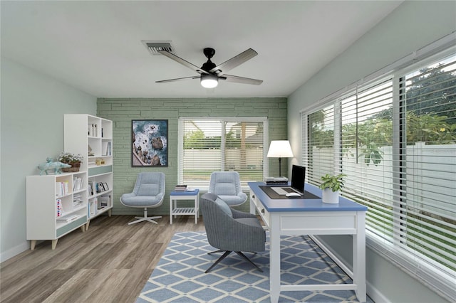 office space with wood-type flooring and ceiling fan