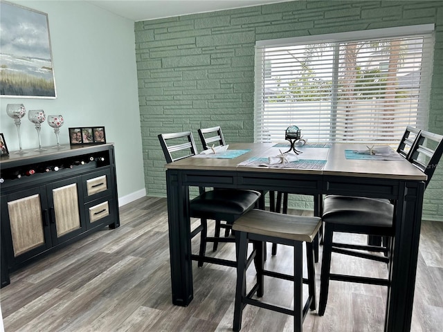 dining space featuring hardwood / wood-style flooring