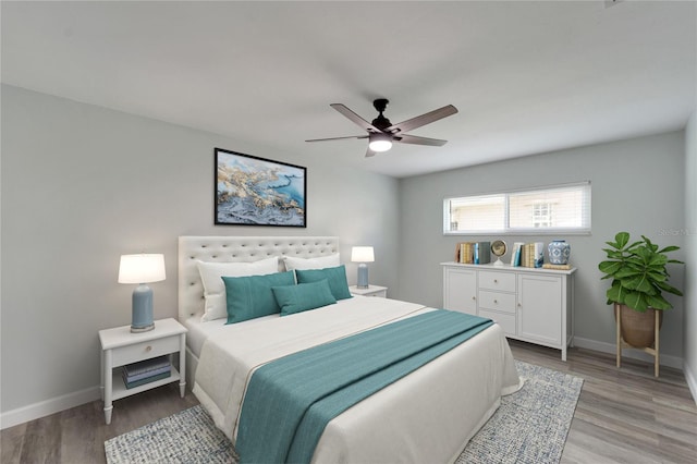 bedroom featuring wood-type flooring and ceiling fan