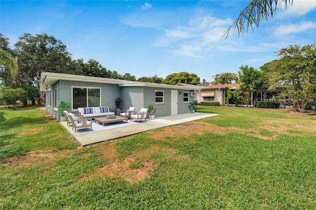 rear view of property with an outdoor hangout area, a lawn, and a patio