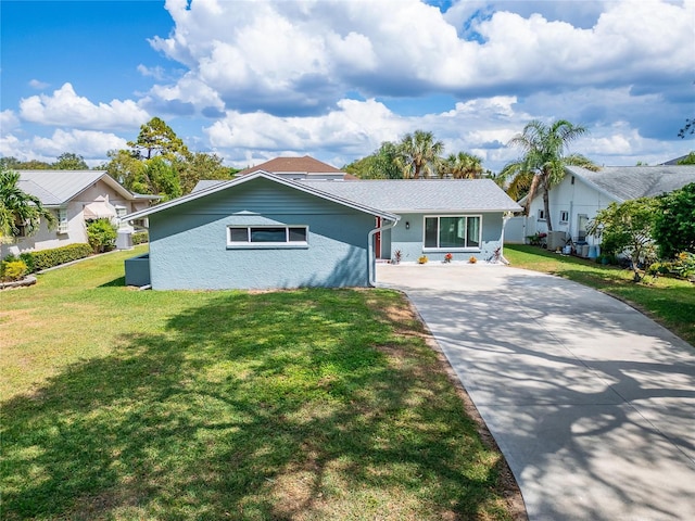 ranch-style house with a front lawn