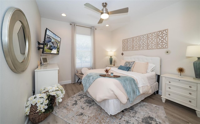 bedroom featuring wood-type flooring and ceiling fan