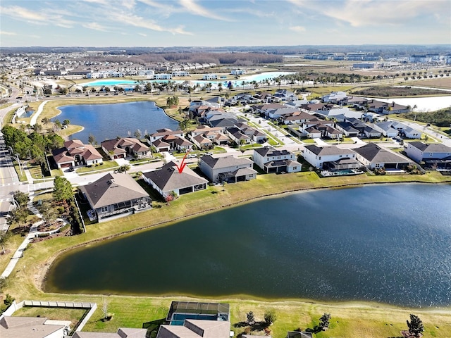 birds eye view of property with a water view