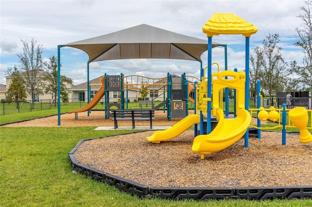 view of jungle gym with a lawn