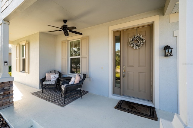 entrance to property featuring ceiling fan