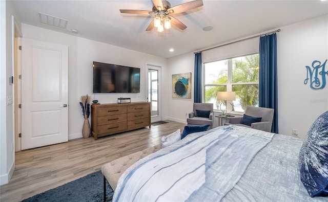 bedroom featuring light hardwood / wood-style flooring and ceiling fan