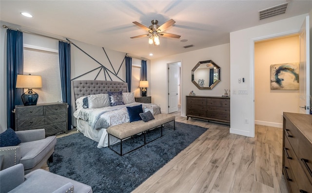 bedroom featuring ceiling fan and light hardwood / wood-style flooring