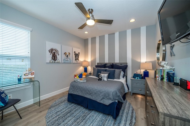 bedroom featuring ceiling fan and light wood-type flooring