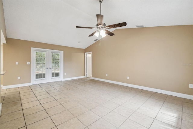 spare room featuring light tile patterned flooring, lofted ceiling, ceiling fan, and french doors