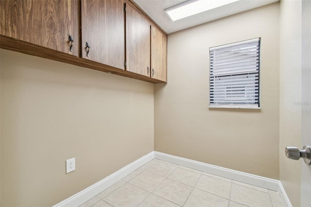 laundry room featuring a textured ceiling