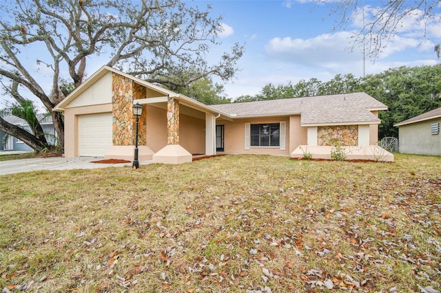 single story home with a garage and a front lawn