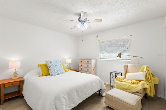 bedroom featuring a textured ceiling and ceiling fan