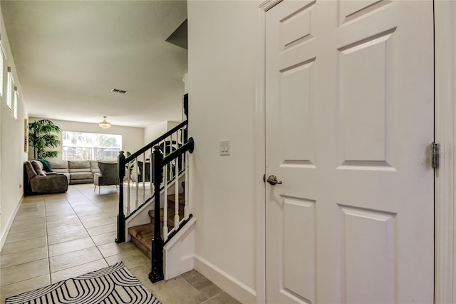 staircase with tile patterned flooring