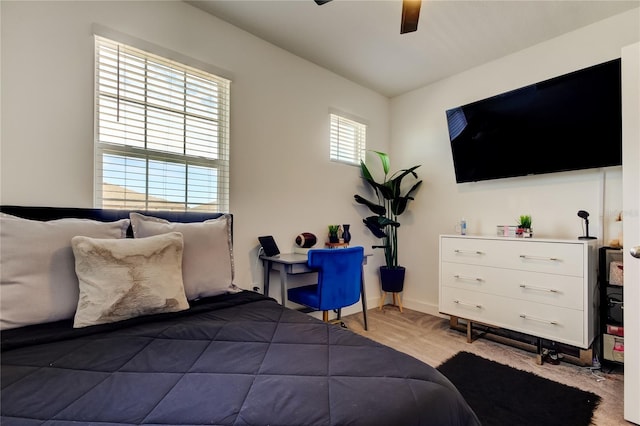 bedroom with hardwood / wood-style flooring and ceiling fan