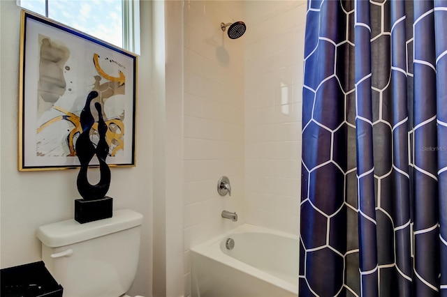 bathroom with shower / tub combo with curtain and toilet