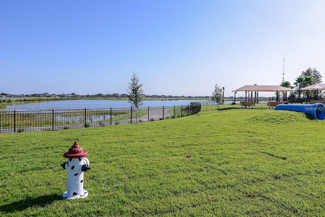 view of yard featuring a water view and a gazebo