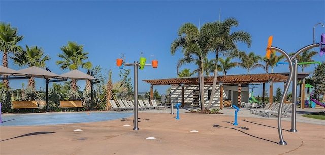 exterior space featuring a pergola and a playground