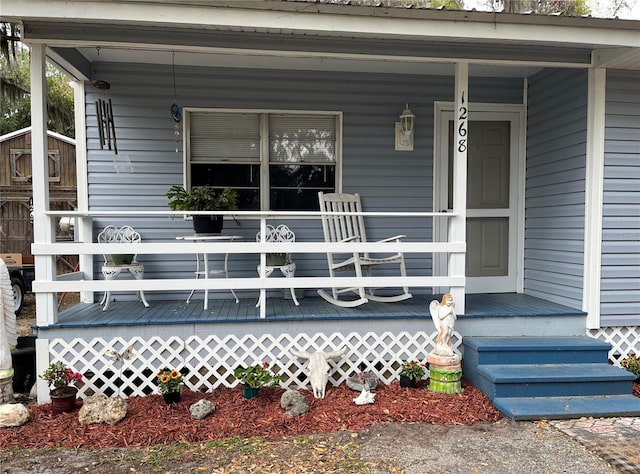 doorway to property featuring covered porch