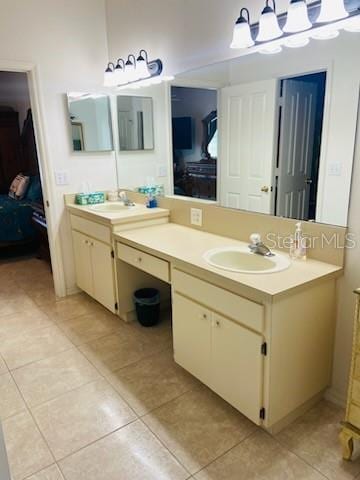 bathroom with tile patterned flooring and vanity