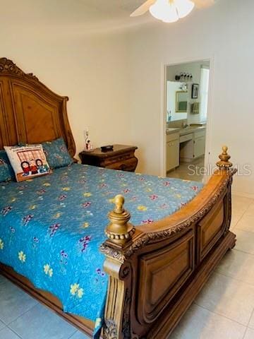 tiled bedroom with ceiling fan and ensuite bathroom