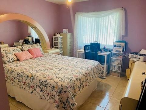 bedroom with light tile patterned flooring