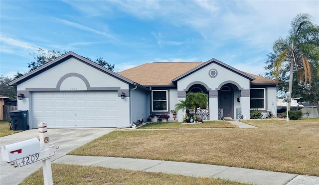 ranch-style house featuring a garage, a front yard, concrete driveway, and stucco siding