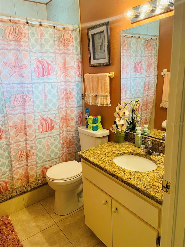 full bathroom featuring toilet, curtained shower, tile patterned flooring, and vanity