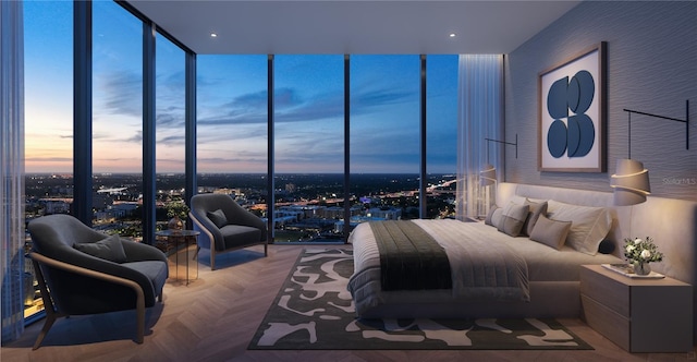 bedroom with expansive windows and parquet floors