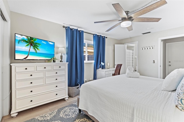 bedroom featuring hardwood / wood-style flooring and ceiling fan