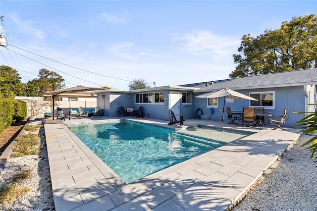 view of swimming pool with a patio area