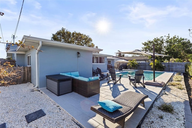 view of patio / terrace featuring an outdoor living space and a fenced in pool