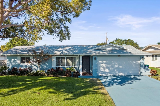 single story home with a garage and a front lawn