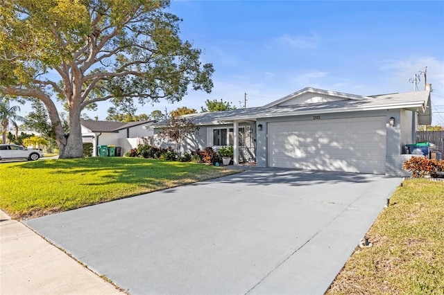 single story home featuring a garage and a front lawn