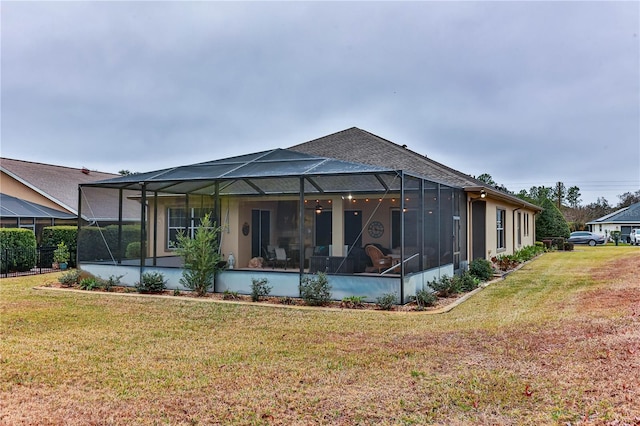 exterior space with a lanai and a yard