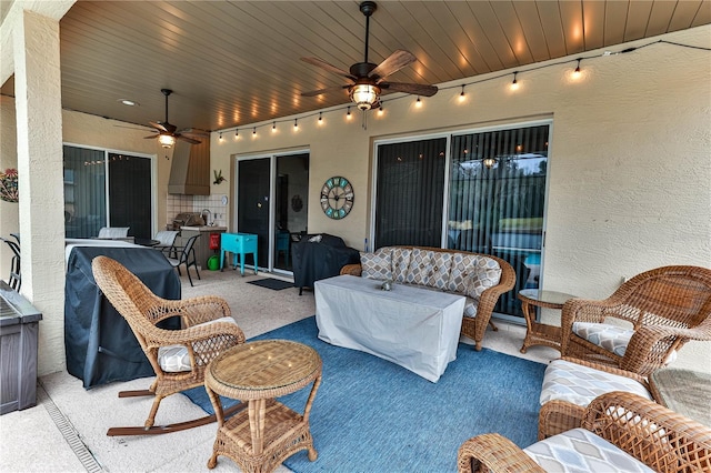 view of patio featuring area for grilling, an outdoor hangout area, and ceiling fan