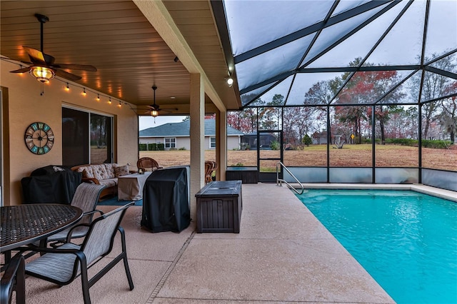 view of pool with ceiling fan, a lanai, an outdoor hangout area, and a patio