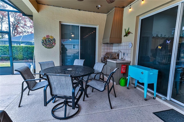 view of patio with sink and grilling area