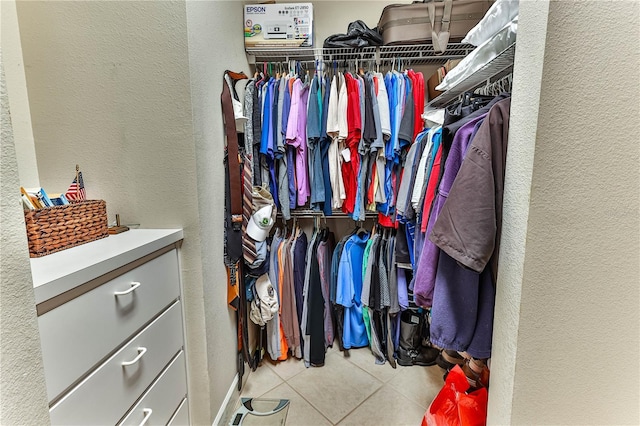 spacious closet featuring tile patterned floors