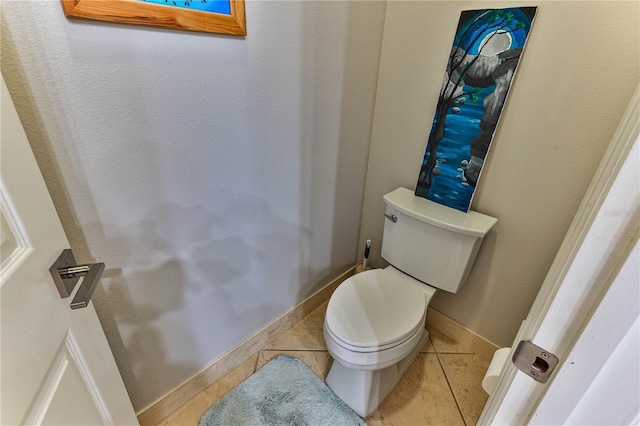 bathroom with tile patterned flooring and toilet