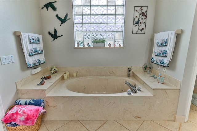 bathroom featuring a washtub and tile patterned floors