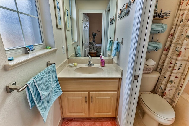 full bathroom featuring vanity, toilet, and shower / bath combo with shower curtain