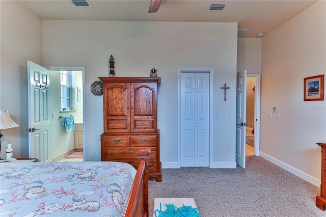 carpeted bedroom with ceiling fan, connected bathroom, and a closet