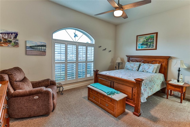 bedroom featuring ceiling fan and light carpet