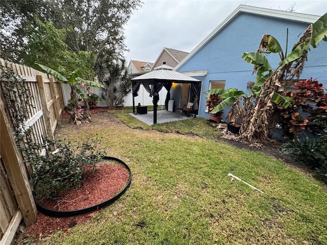 view of yard featuring a gazebo and a patio area