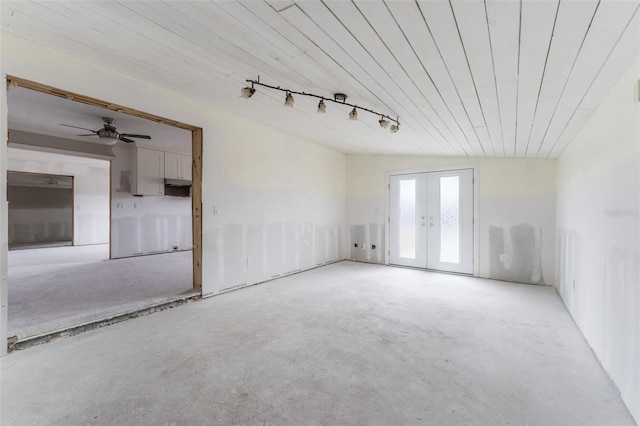 unfurnished room with french doors, track lighting, and wood ceiling