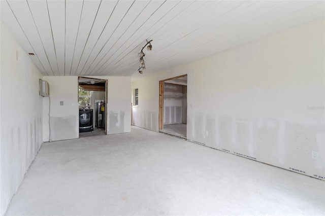 spare room featuring washer / dryer and water heater