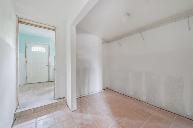 entryway with light tile patterned floors