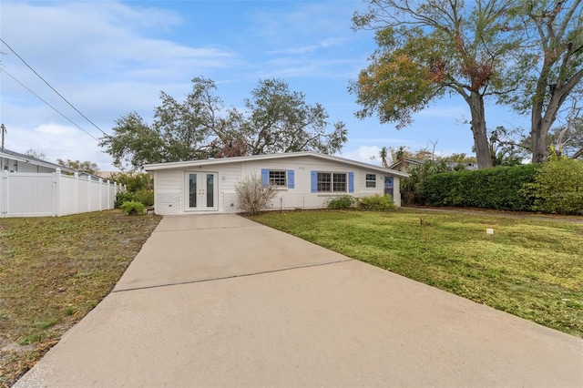 ranch-style home with a front yard